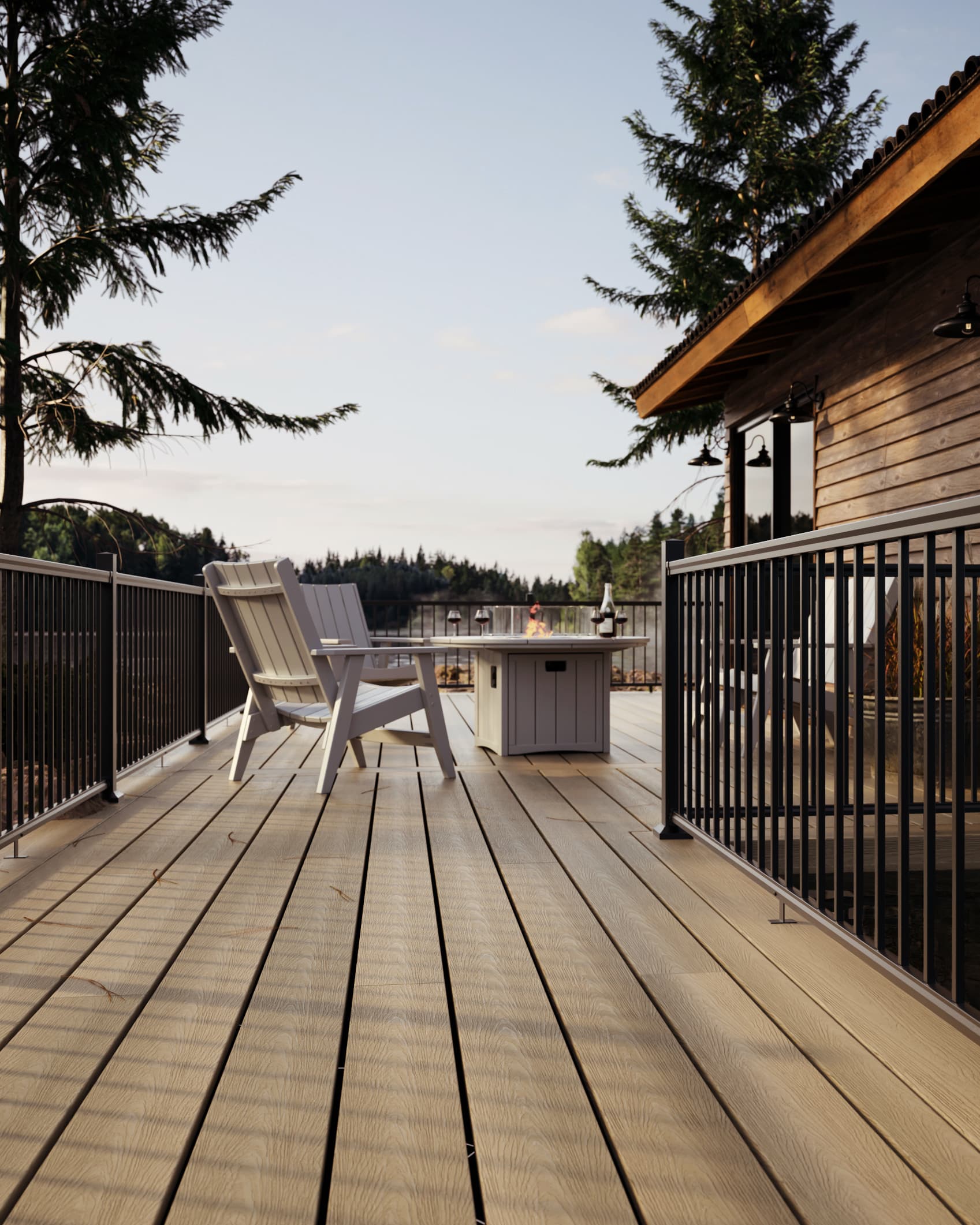 Light composite lakeside deck with black aluminum railings, Adirondack chairs, and a fire table